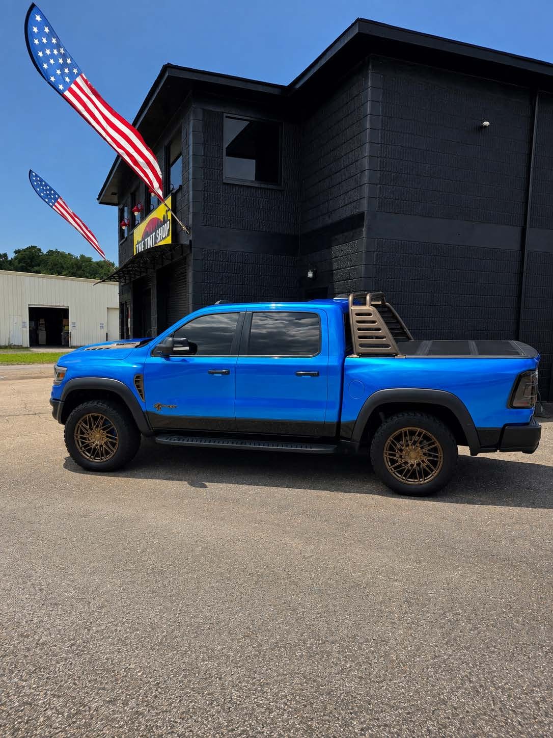 Custom blue Ram TRX with tinted windows — The Tint Shop of Mobile