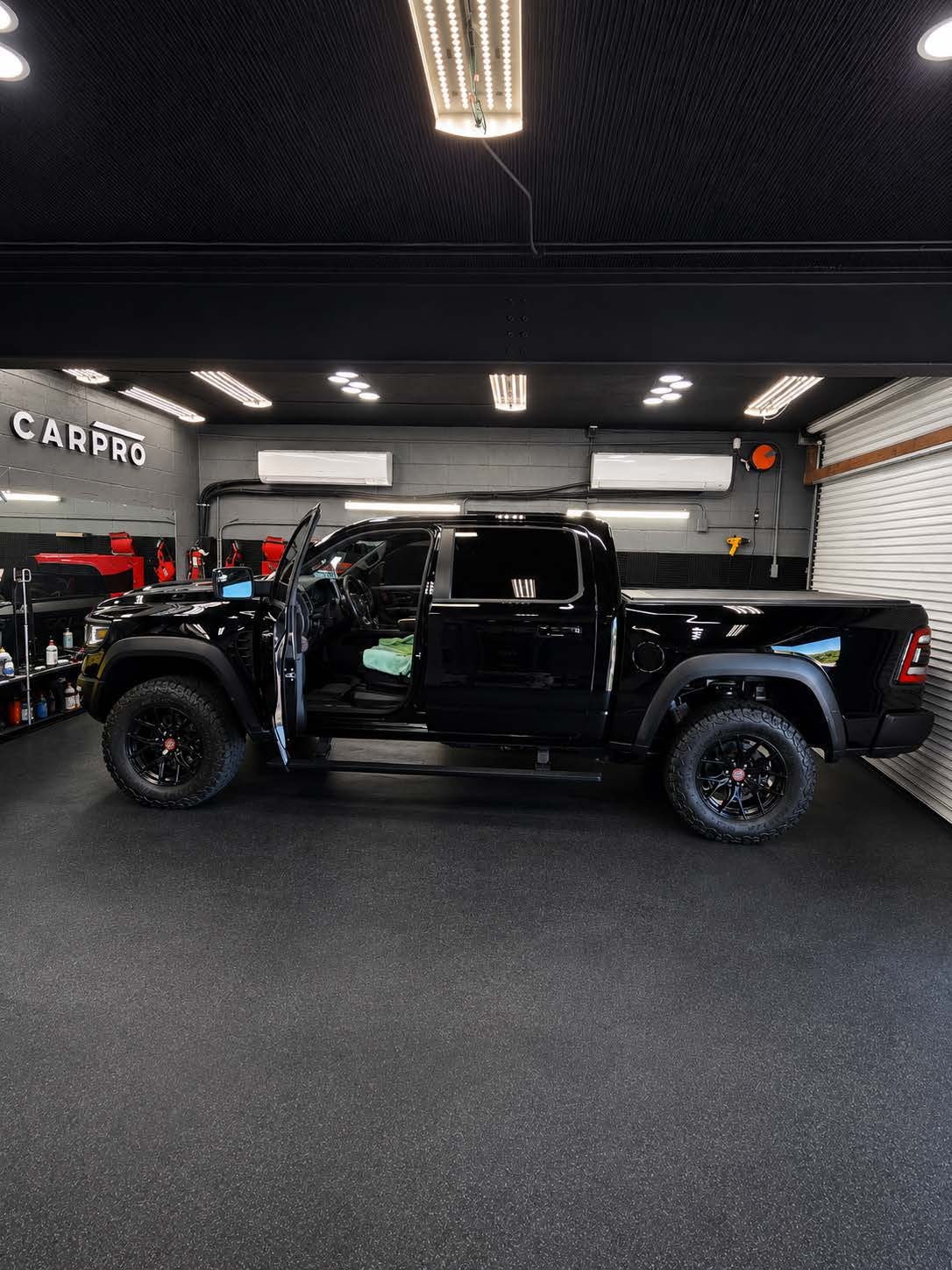 Professional window tint installer at work at The Tint Shop of Mobile